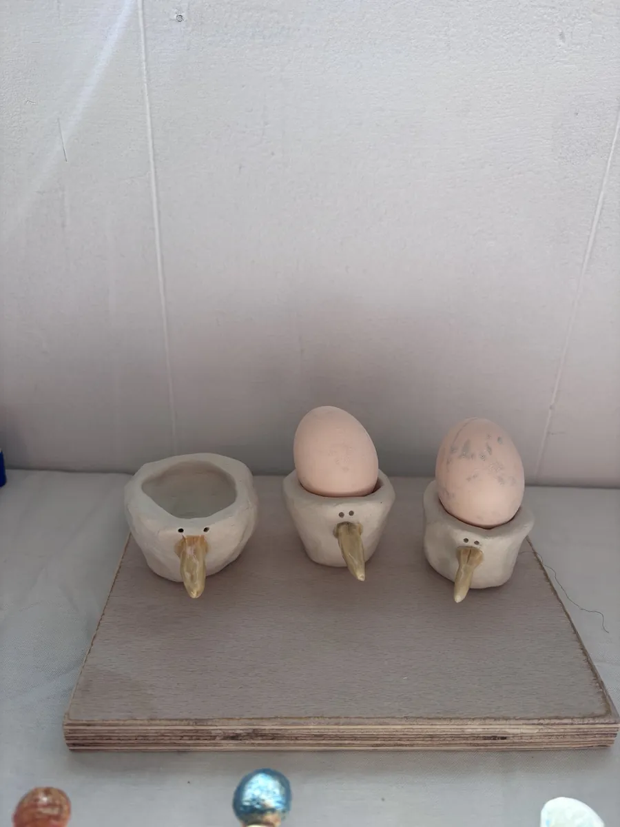 Three bird egg cups with long glazed beaks