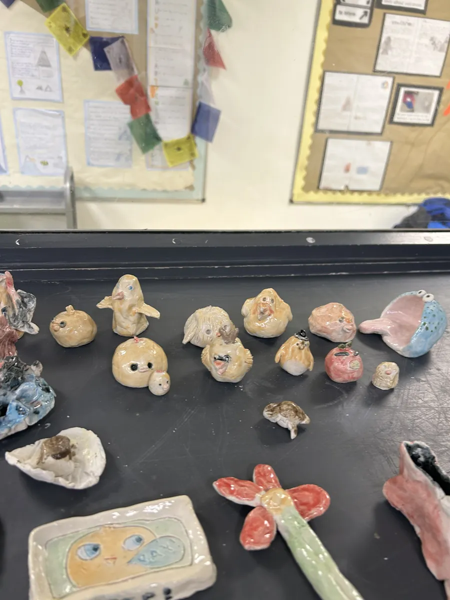 A flock of little glazed birds and a wide-mouthed blue creature