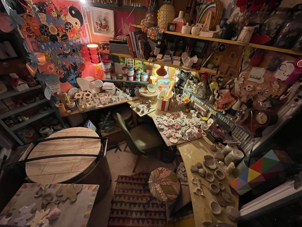 Gemma's studio at night with the kiln and children's pieces on the bench