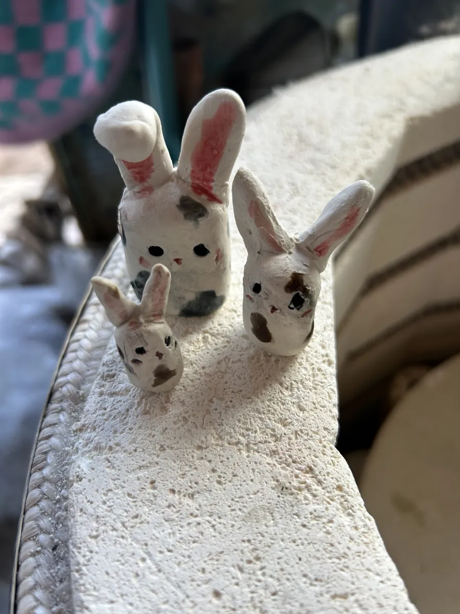 Three spotty clay bunnies with pink ears