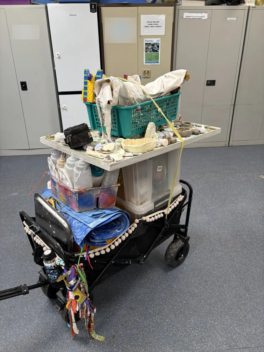 Gemma's trolley loaded with clay club kit, ready to wheel in