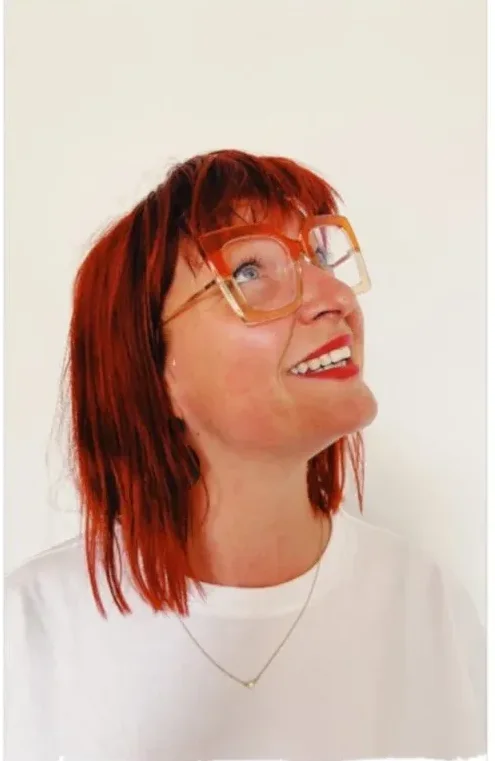 Gemma laughing, head tilted back