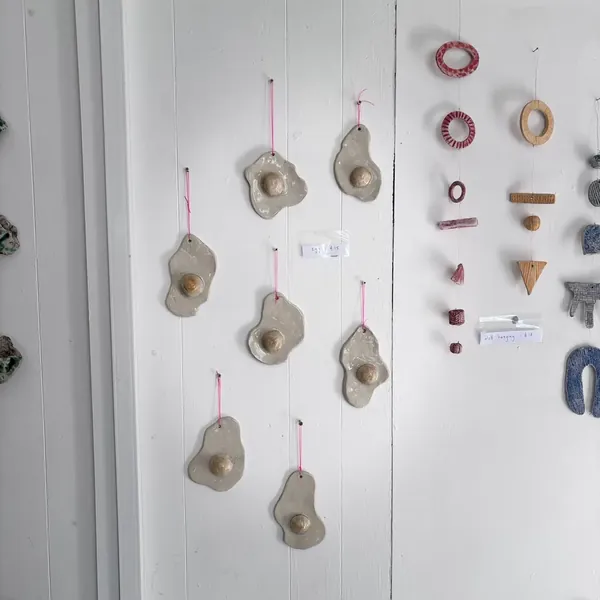 Glazed fried-egg wall hangings