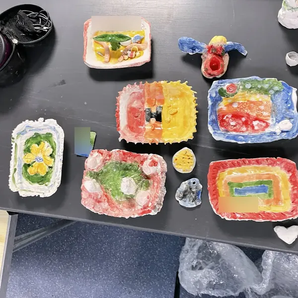 Brightly glazed dishes made at clay club