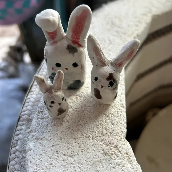 Three spotty clay bunnies